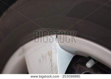 Silver Car Tire Rim Is Broken And Scratched Because Of Hitting Something, Cracked, Needed To Replace