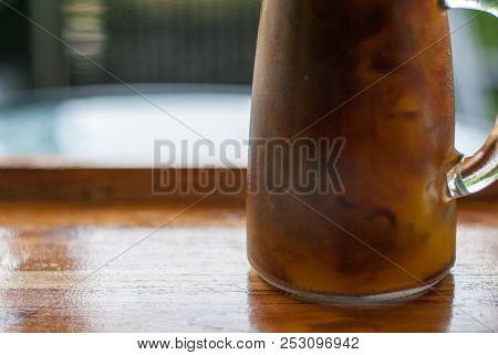Close Up Iced Latte Coffee Ready To Drink In Tall-shape Glass On The Wooden Tray, Perfect For Sleepy