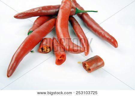 Red chilly chutney and chilies on white background. a rural food item in India.
