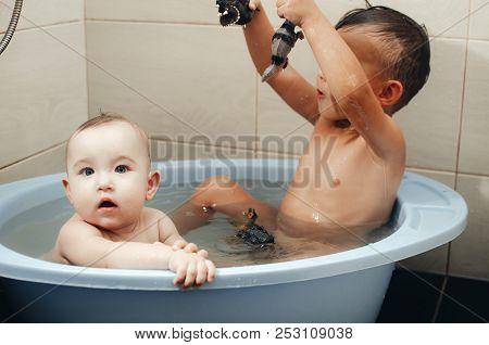 Children, Brother And Sister In The Bathroom