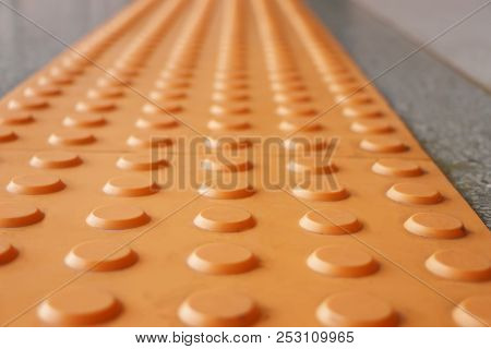 Tactile Paving  Is A System Of Textured Ground Surface Indicator Found On Footpaths, Stairs And Trai