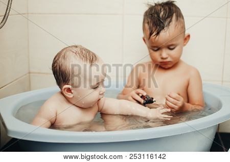 Children, Brother And Sister In The Bathroom