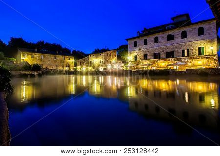 Ancient Thermal Bath In Bagno Vignoni, A Medieval Village In Tuscany, In The Evening, Italy