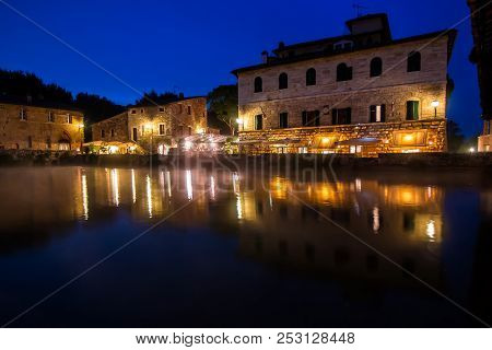 Ancient Thermal Bath In Bagno Vignoni, A Medieval Village In Tuscany, In The Evening, Italy