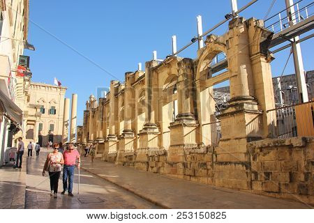 Valletta, Malta - May 2018: People Walk Near Old Ruined Opera House In Valletta