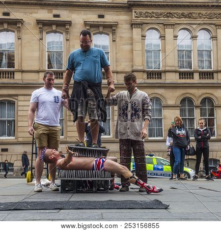 Edinburgh, Scotland  - August 7: Street Performer Spikey Will Attepts A Dangerous Stunt On A Bed Of 