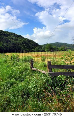 Old Wooden Barn, With Rusting Tin Roof, Sits In Open Field In A Valley In Northern Arkansas. Ozark M