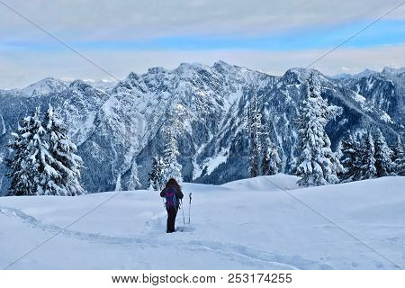 Woman Hiking Snowshoeing In North Shore Mountains Near Vancouver. Cypress Mountain Ski Resort In Win
