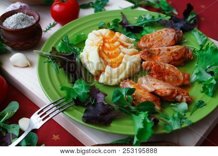Fried Chicken Wings With Potato Puree, Sprinkled With Sweet Paprika Sauce.