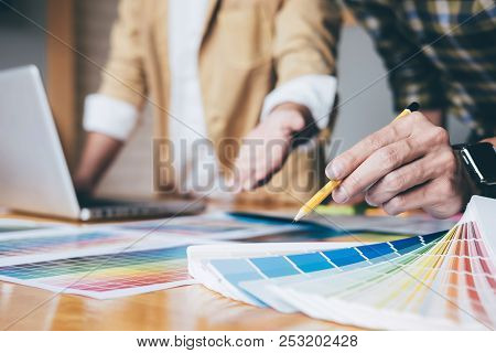 Young Creative Team Having A Meeting In Creative Office, Architectural Drawing With Work Tools And A