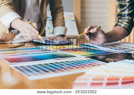 Young Creative Team Having A Meeting In Creative Office, Architectural Drawing With Work Tools And A