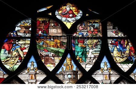 PARIS, FRANCE - JANUARY 11, 2018: Sacrifice and Solomon's Dream in Gabaon, and right, the Visit of the Queen of Sheba, stained glass window in the Saint Gervais and Saint Protais Church, Paris.