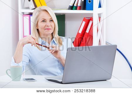 Business Woman Working On A Aptop. Chatting With The Client Online Via Chat. Stormy Emotions Express