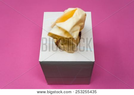 Facial Tissue Cube Box. Peach Colored Tissue Paper.