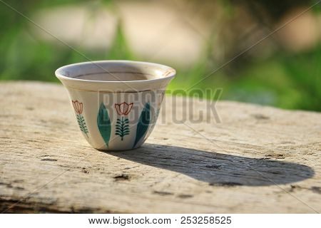 A Traditional Lebanese Coffee Cup On A Wooden Table.