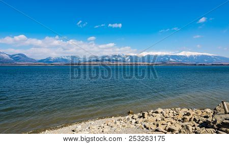 Slovakia: Liptovska Mara Lake With The Tatra Mountains In The Background. Winter Mountains, Clouds