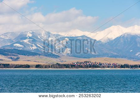 Slovakia: Small Village Near The Tatra Mountain. Liptovska Mara Lake In Foreground. Winter And Snow