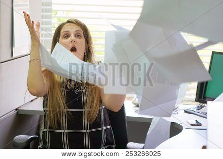 Overworked Angry Businesswoman Throwing Paper All Over The Office. Stressed Woman Throwing Charts Or