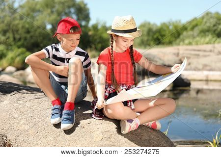 Little Children With Map Outdoors. Summer Camp
