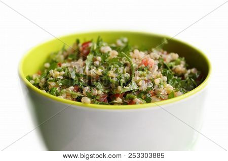 A Bowl Of Lebanese Tabbouleh Made With Quinoa Instead Of Traditional Burghul.