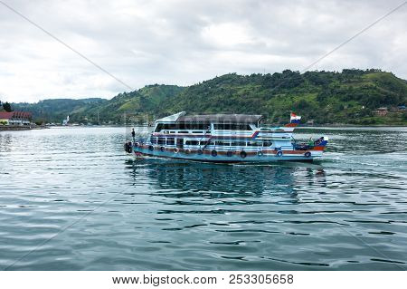Lake Toba Is A Large Natural Lake Occupying The Caldera Of A Supervolcano, Located In The Middle Of 