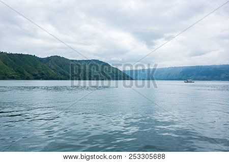 Lake Toba Is A Large Natural Lake Occupying The Caldera Of A Supervolcano, Located In The Middle Of 