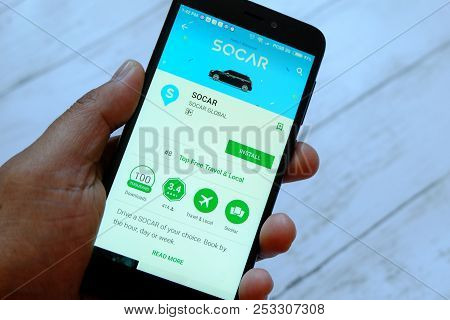 Bandar Seri Begawan,brunei - July 25th,2018 : A Male Hand Holding Smartphone With Socar App On An An