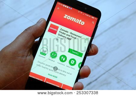 Bandar Seri Begawan,brunei - July 25th,2018 : A Male Hand Holding Smartphone With Zomato App On An A