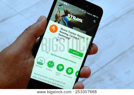 Bandar Seri Begawan,brunei - July 25th,2018 : A Male Hand Holding Smartphone With Strava Apps On An 