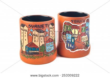 Georgian Clay Pottery With Traditional Ornaments On It. White Background