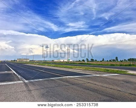 Quiet Street In The Plains With Stormclouds