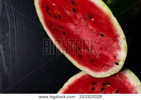 One Watermelon Cut In Halves Isolated On Black Background With Clipping Path