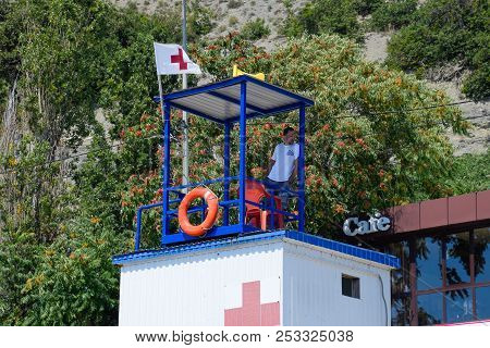 Novorossiysk, Russia - August 06, 2018: The Rescuer On The Rescue Tower Observes The Shore. Novoross