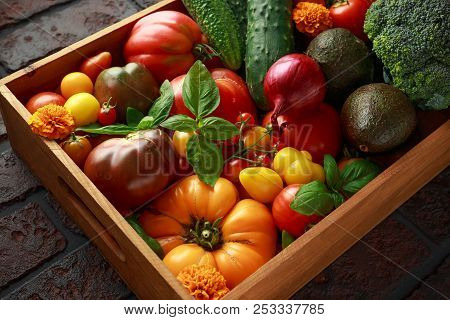 Organic Vegetable Box With Large, Cherry Tomatoes, Basil, Cucumbers, Red Onions, Broccoli And Avocad