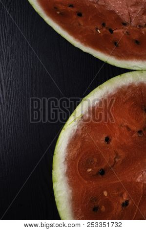 One Watermelon Cut In Halves Isolated On Black Background With Clipping Path