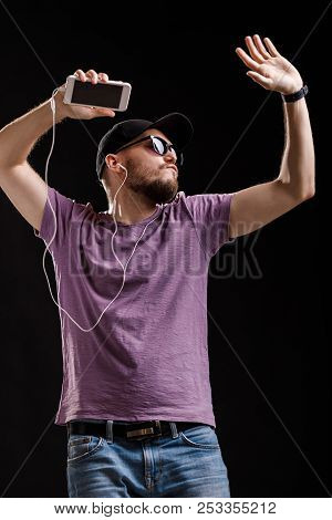 The Man Listening To Music In Headphones