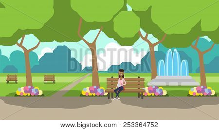 City Park African Woman Holding Laptopn Sitting Wooden Bench Green Lawn Flowers Fountain Trees Citys