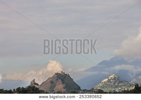 Hills With Castle And Church Outside Of Swiss Town Sion In Wallis Or Valais Landscape