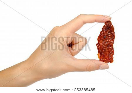 Sun Dried Red Tomatoes With Hand Isolated On White Background