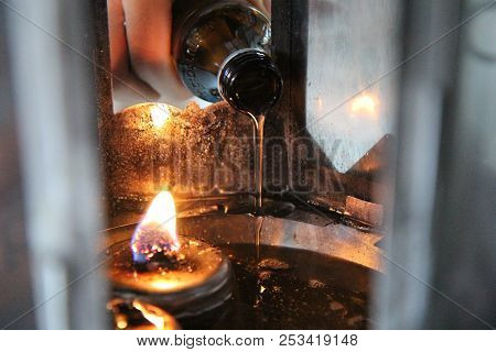 Buddhists Make Merit,oil Fill In A Lamp For Lighting And For Use In Incense. Means To Make Life Smoo