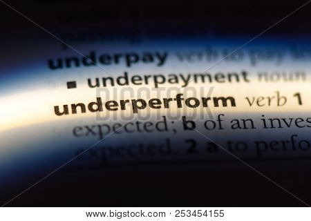 Underperform Word In A Dictionary. Underperform Concept.