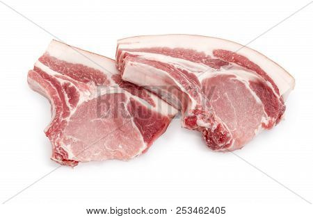 Two Uncooked Pork Loin Chops With Ribs On A White Background
