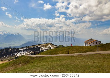 Green Grass Field On Top Of Rigi Kulm Luzern Switzerland With Alps Snow Mountain View A
