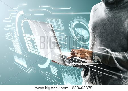Hacker Using Laptop With Interface On Blurry Background. Hacking And Identity Concept. Double Exposu