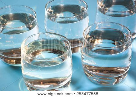 Glasses Of Water On Pastel Blue. Close Up. Water Balance For Healthy.
