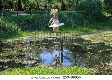 Ballerina Made Of Cloth Over The Water