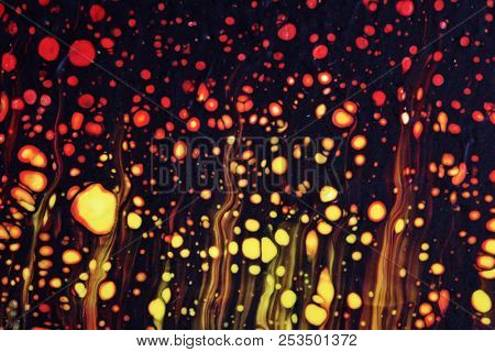 Abstract texture. Modern artwork background. Mixed black red and yellow pianting. Fluid Art. Unusual trendy background for poster, card, invitation. Contemporary art.