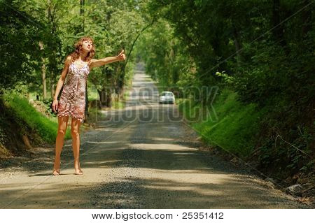 Pretty girl hitching hiking.