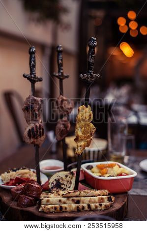 Meat On Skewer Fry With A Cooking Gas Torch Flomber. Preparation Of Delicious Fresh Meat Frying With