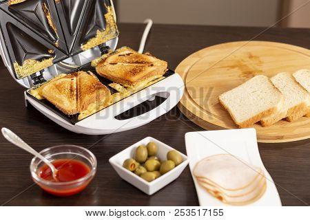 Detail Of Hot Sandwiches Ready For Eating In A Sandwich Maker. Selective Focus On The Sandwiches And